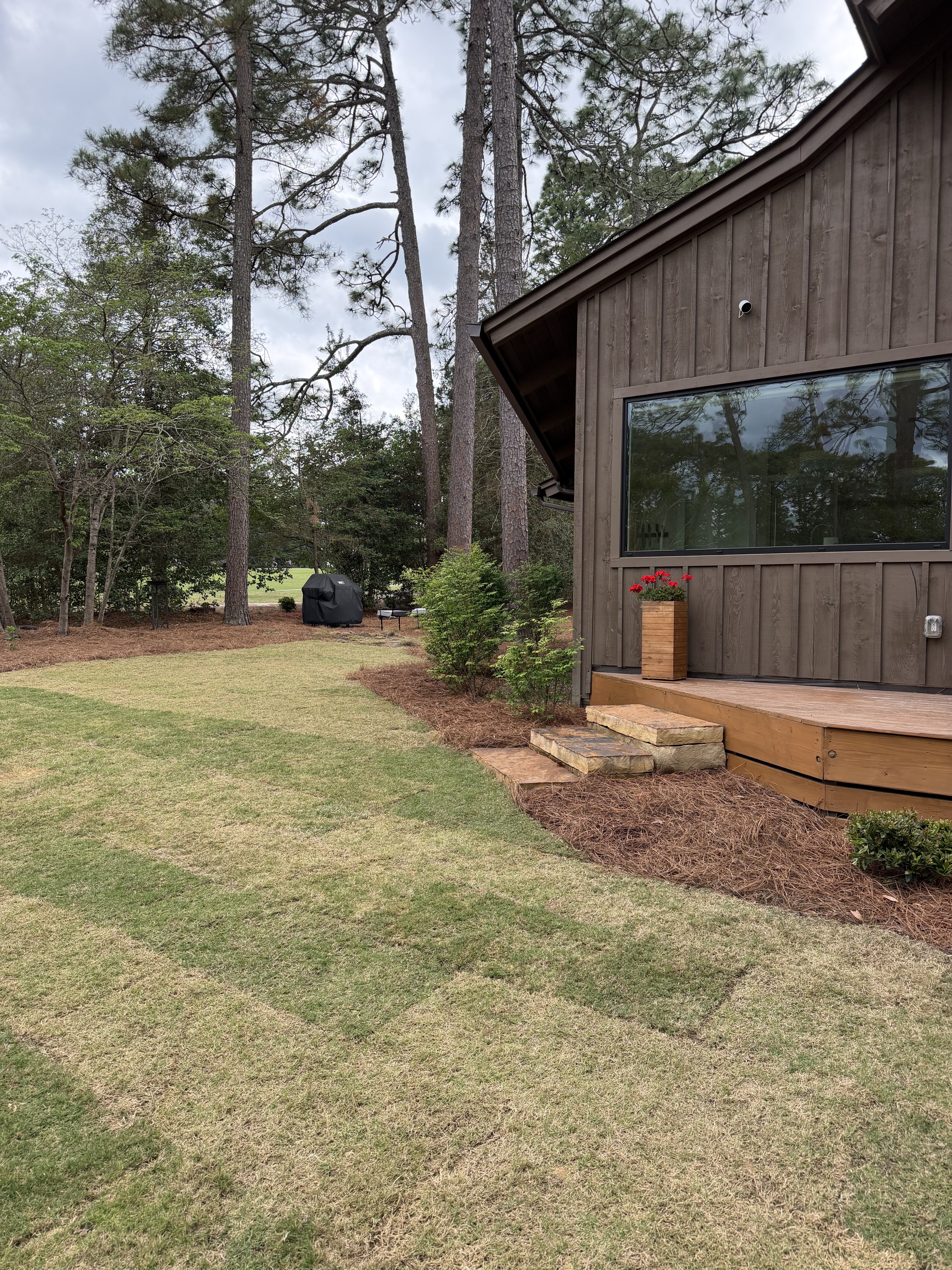 Floral bed with stone edging and seasonal color Moore County NC