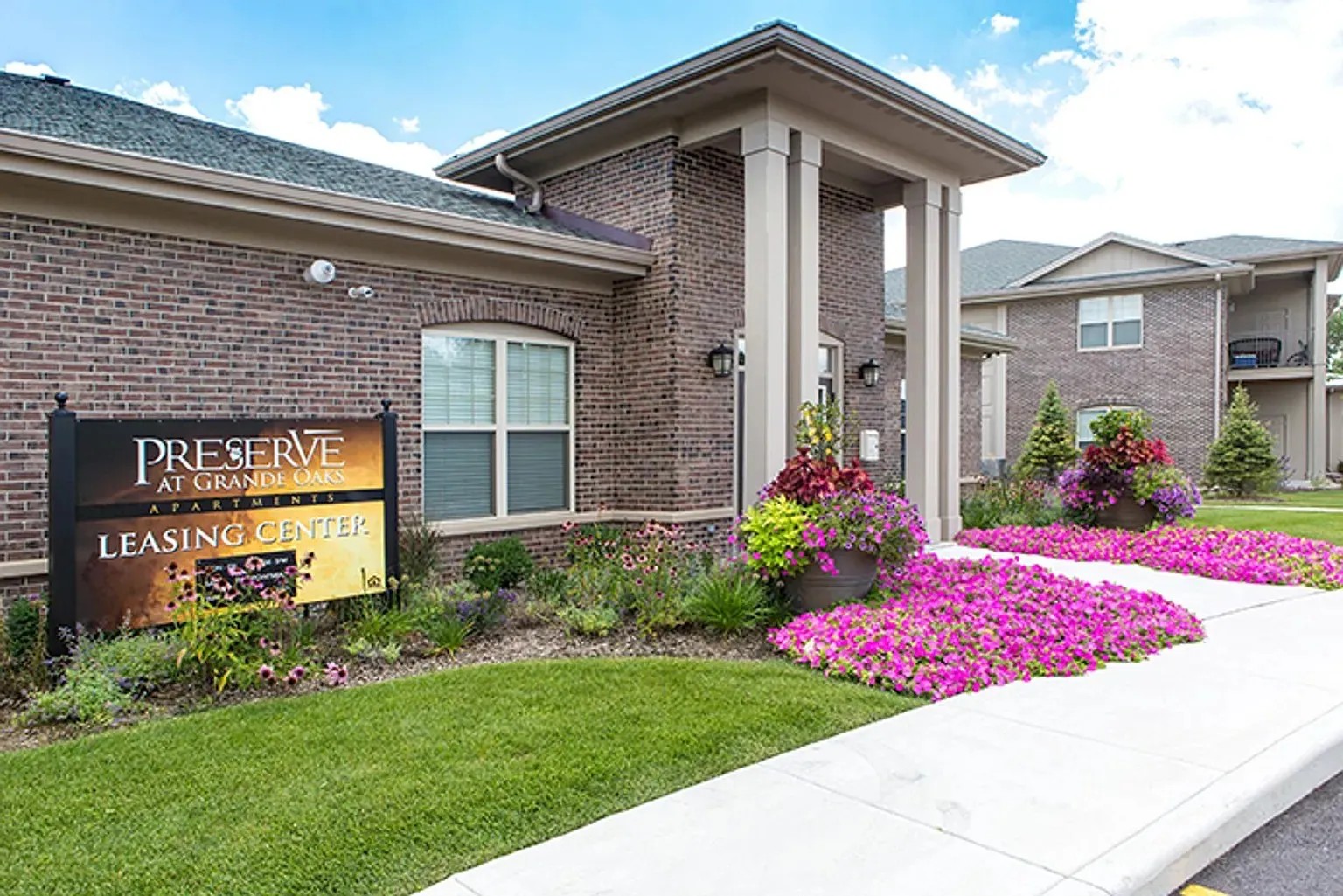 Preserve at Grand Oaks apartments leasing center floral landscaping Fayetteville NC